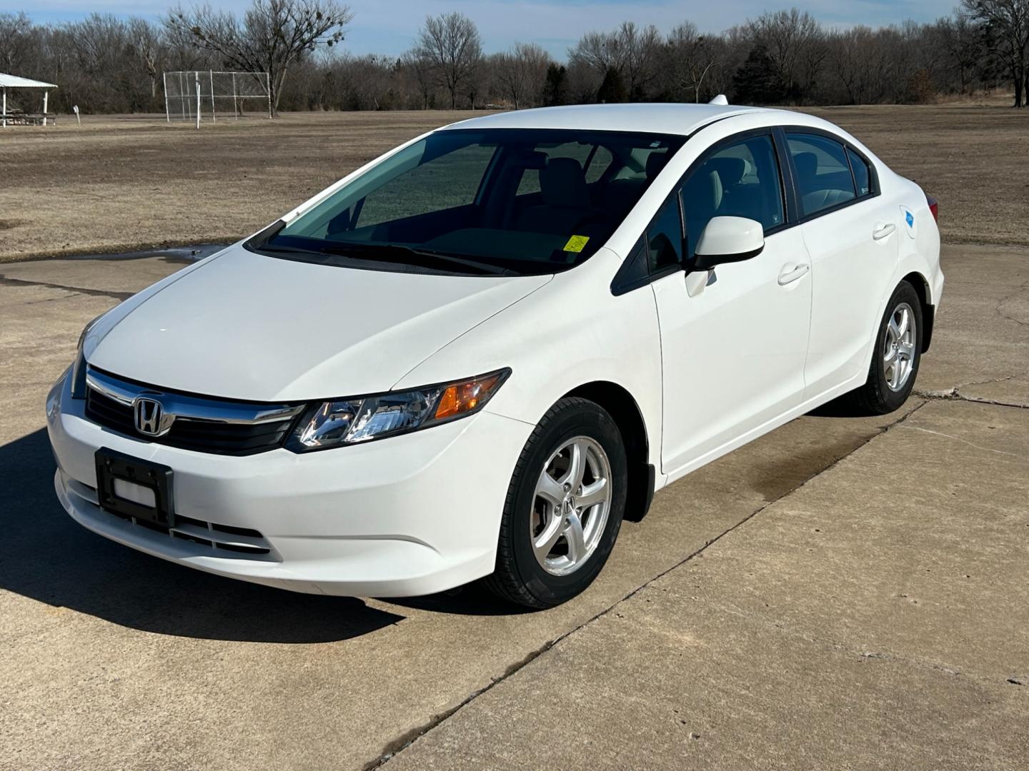 2012 White /Gray Honda Civic CNG Sedan 5-Speed AT (19XFB5F58CE) with an 1.8L L4 SOHC 16V CNG engine, 5-Speed Automatic transmission, located at 17760 Hwy 62, Morris, OK, 74445, (918) 733-4887, 35.609104, -95.877060 - 2012 HONDA CIVIC 1.8L FWD DEDICATED CNG (COMPRESSED NATURAL GAS) VEHICLE. FEATURES REMOTE KEYLESS ENTRY, POWER LOCKS, POWER WINDOWS, POWER MIRRORS, MANUEL SEATS, AM/FM RADIO, CD PLAYER, USB, AUX, BLUETOOTH FOR HANDS-FREE CALLING, 12V POWER OUTLET, CRUISE CONTROL, TRACTION CONTROL, CLOTH SEATS, 195/6 - Photo#0